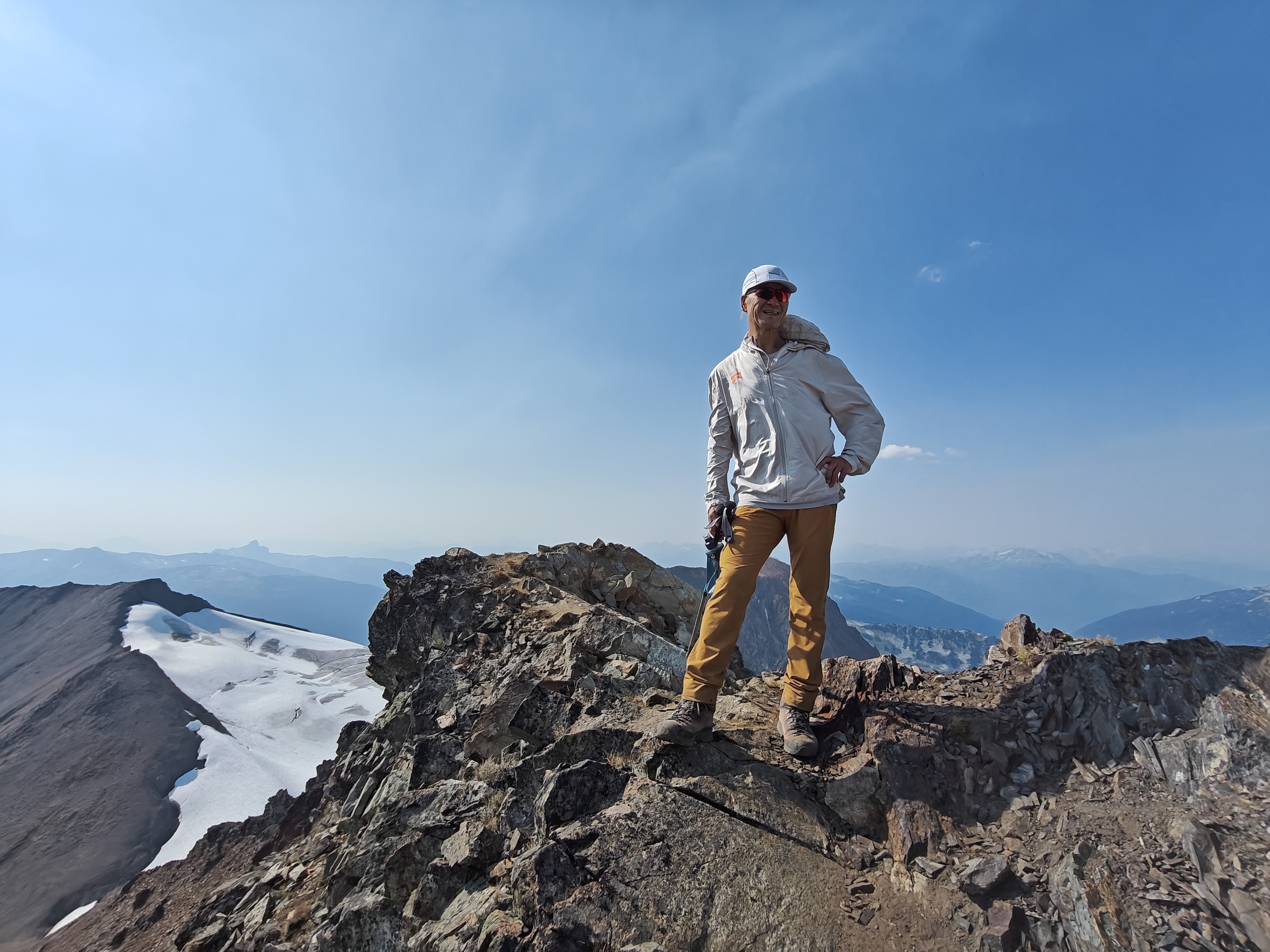 Patrick posing at the summit of Mount Overlord