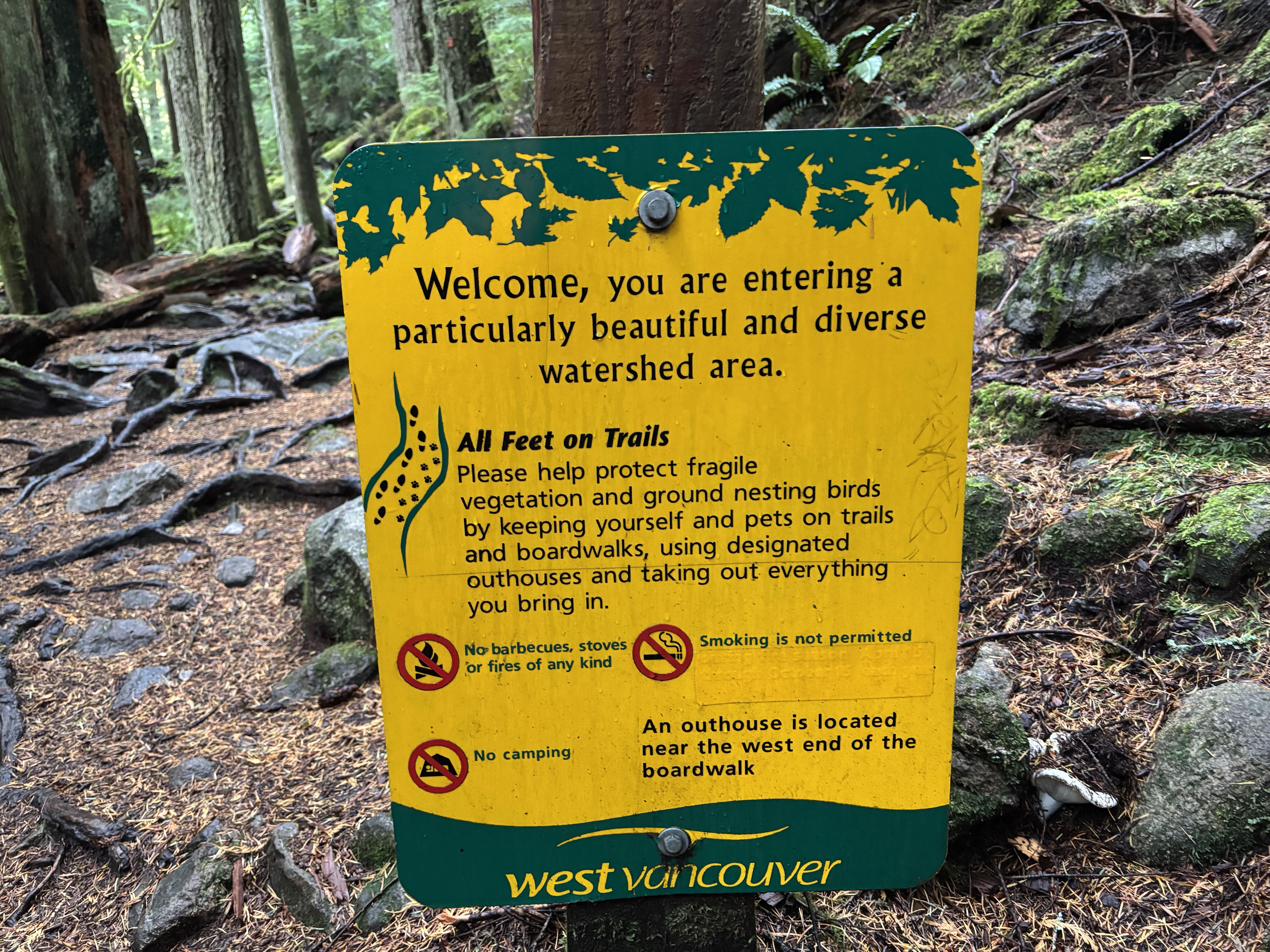 All feet on trails sign