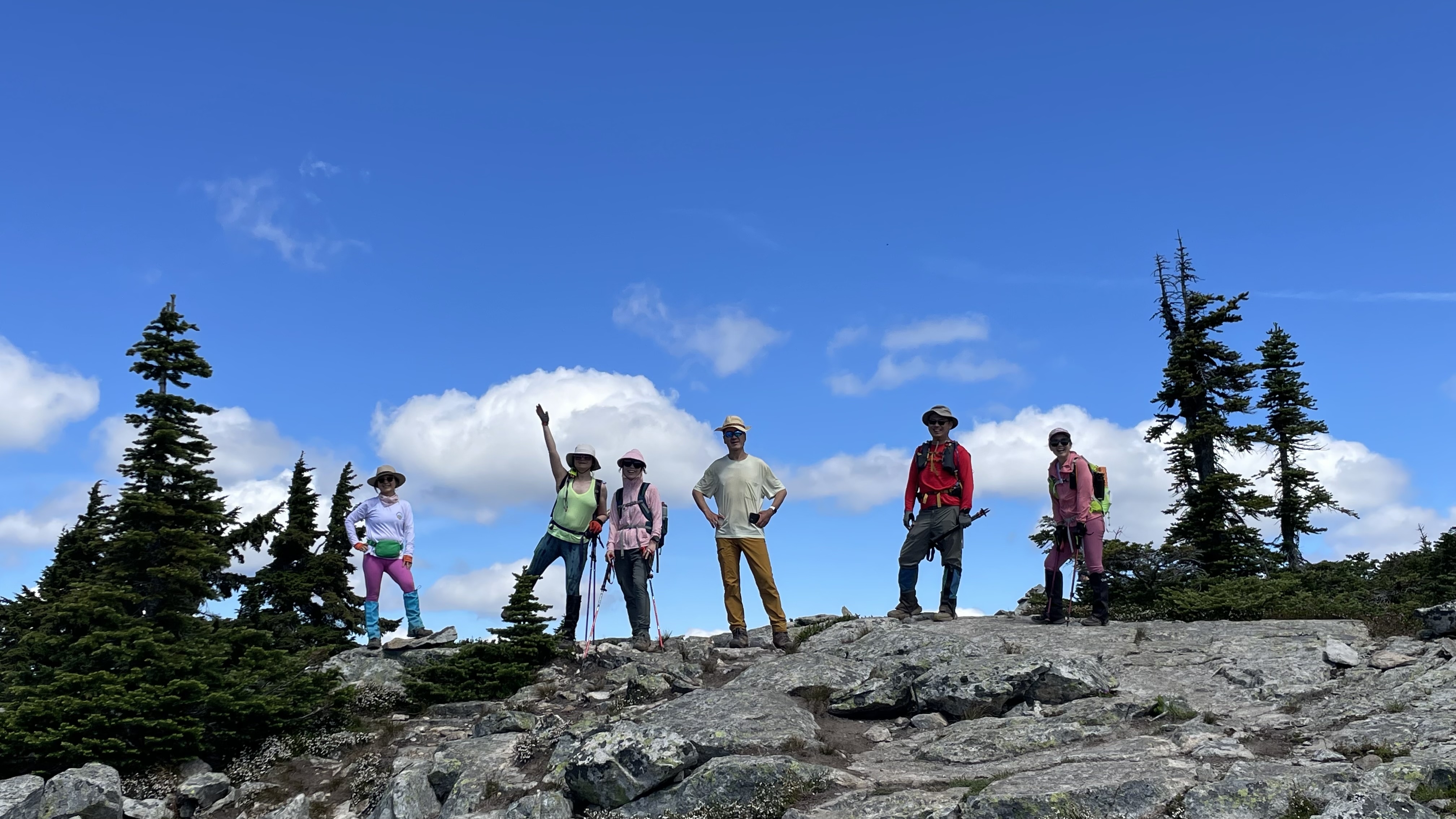 6 people posing at Flora Peak ridge