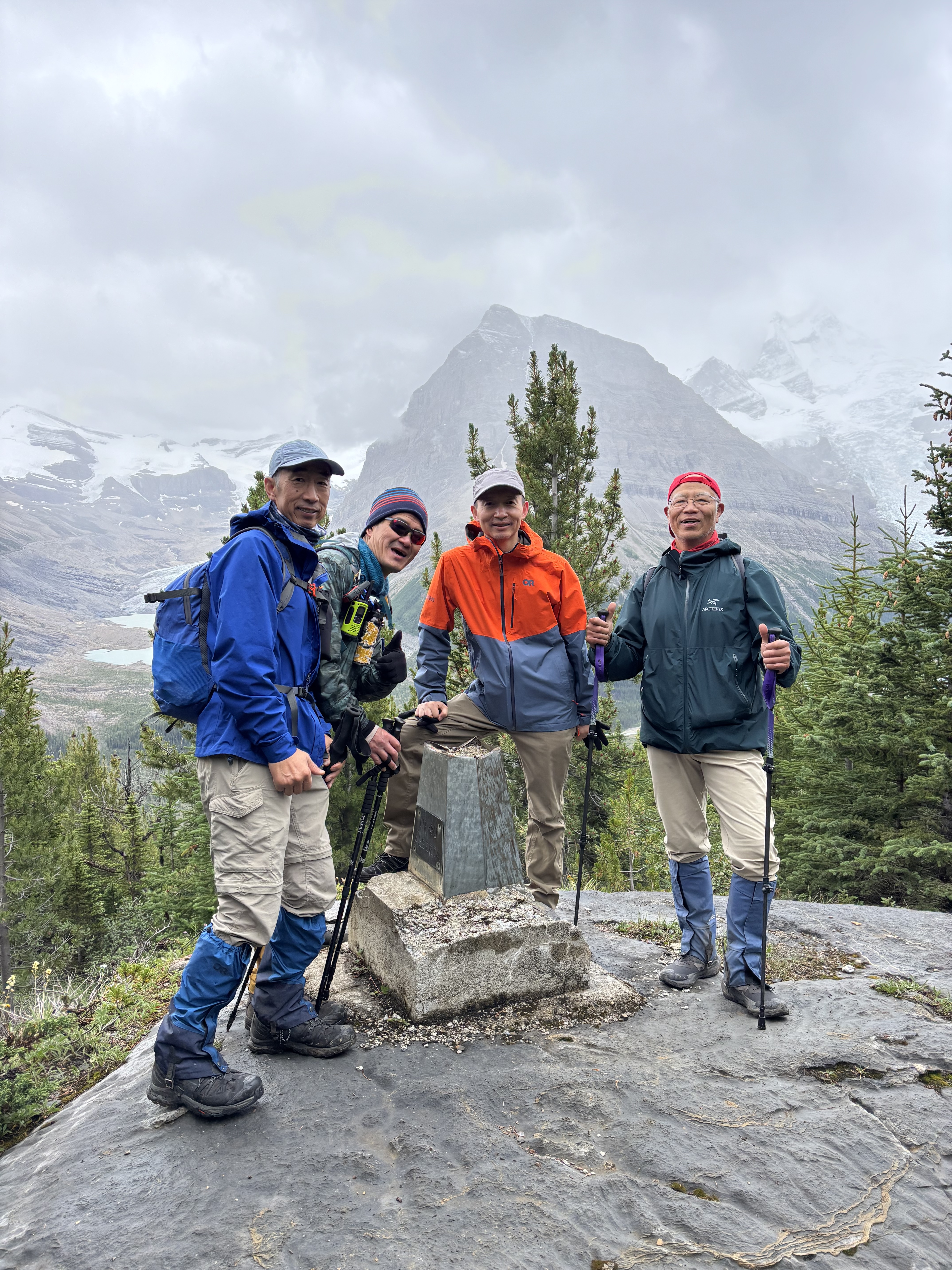 Group photo (4 men) at the BC/AB boundary mark
