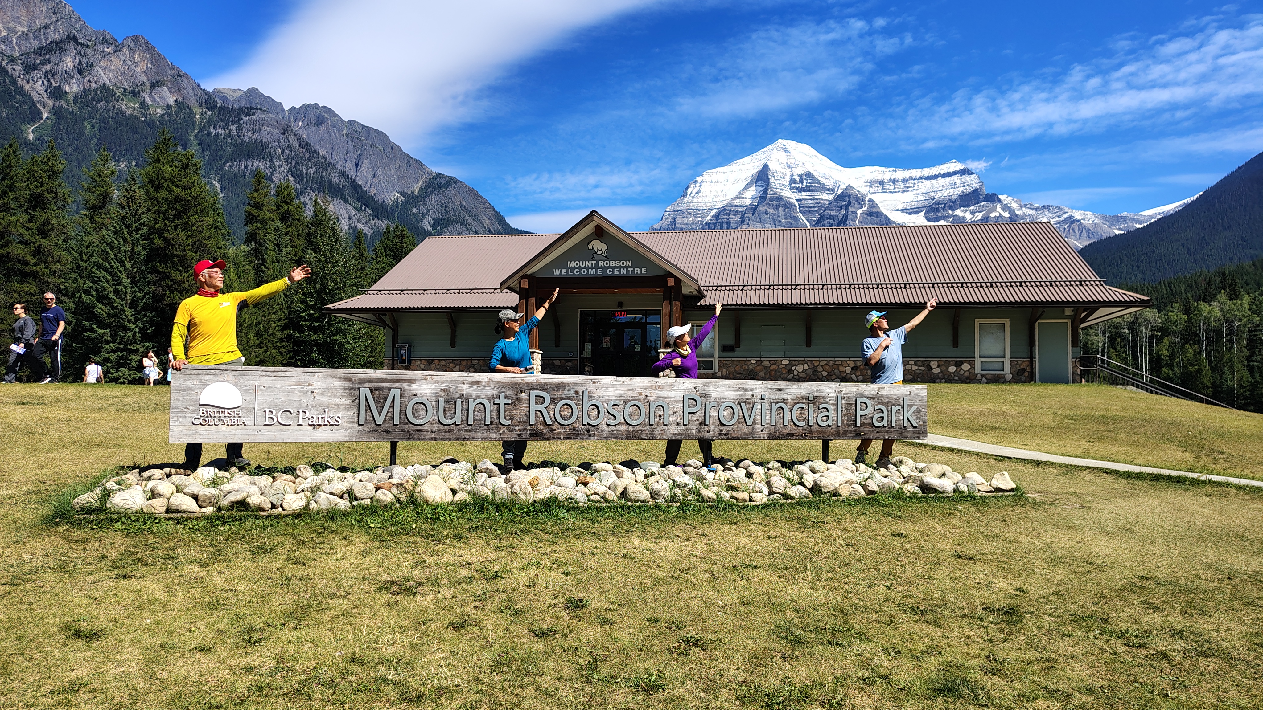 Patrick's team standing behind the Mount Robson Provincial Park wood frame